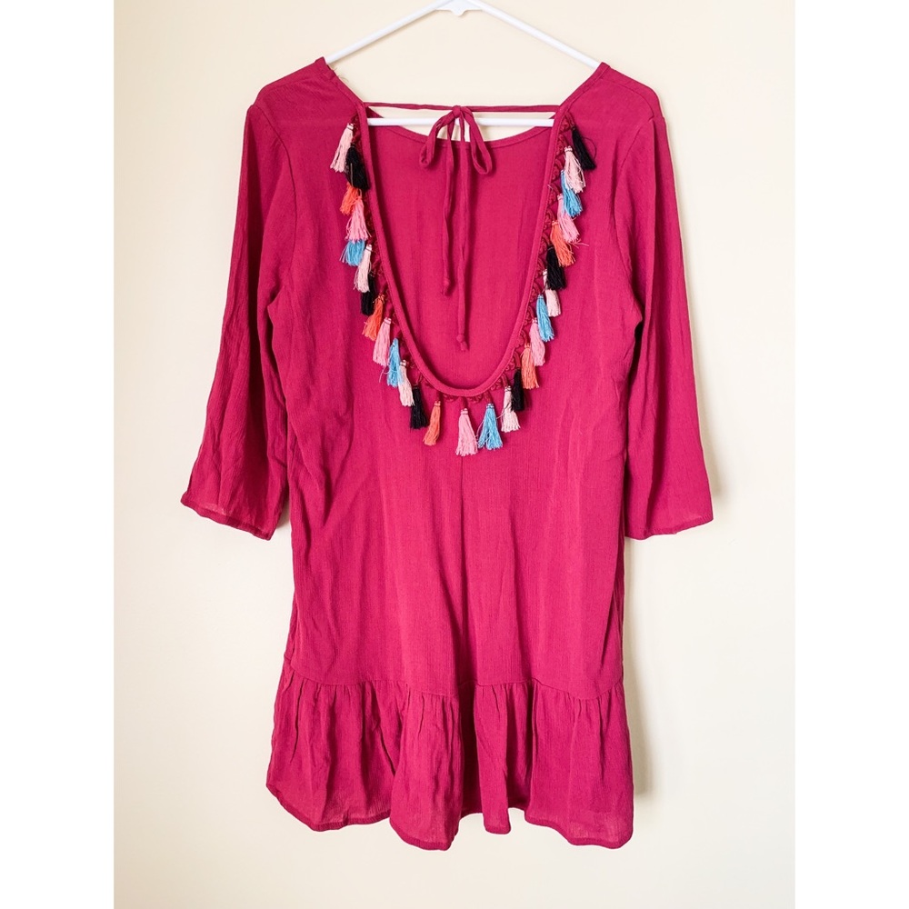 Pink swimsuit cover with frills on the back